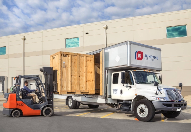 A JK Moving professional loading a truck